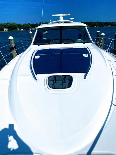 Down Time Yacht Photos Pics 2010 Sea Ray 500 Sundancer yacht on calm water, sunny day.