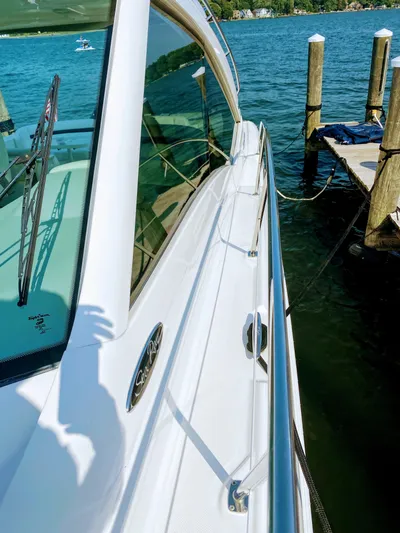 Down Time Yacht Photos Pics 2010 Sea Ray 500 Sundancer yacht docked by a pier on a sunny day.