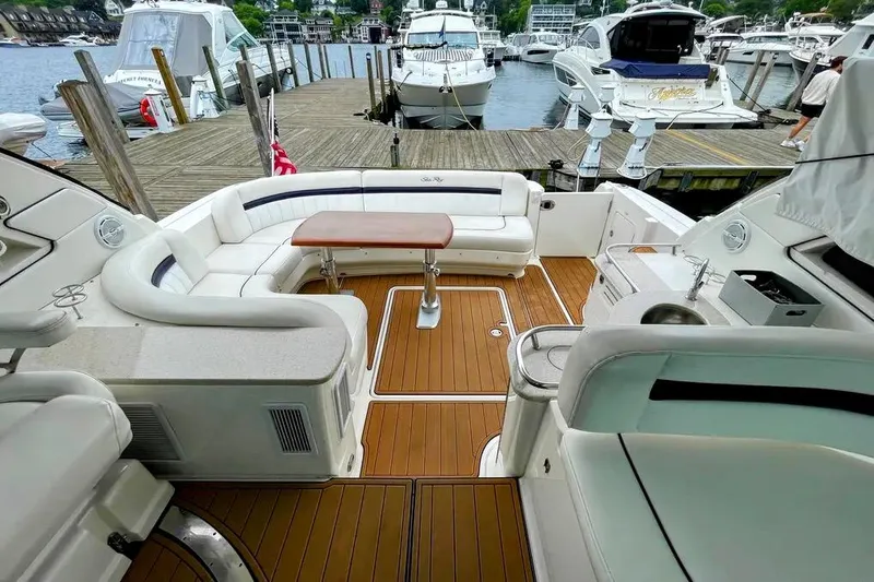 Down Time Yacht Photos Pics Luxurious 2010 Sea Ray 500 Sundancer yacht interior with elegant seating and wooden deck.