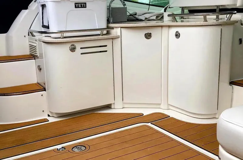 Down Time Yacht Photos Pics Sea Ray 500 Sundancer 2010 yacht interior with teak flooring and white cabinetry.