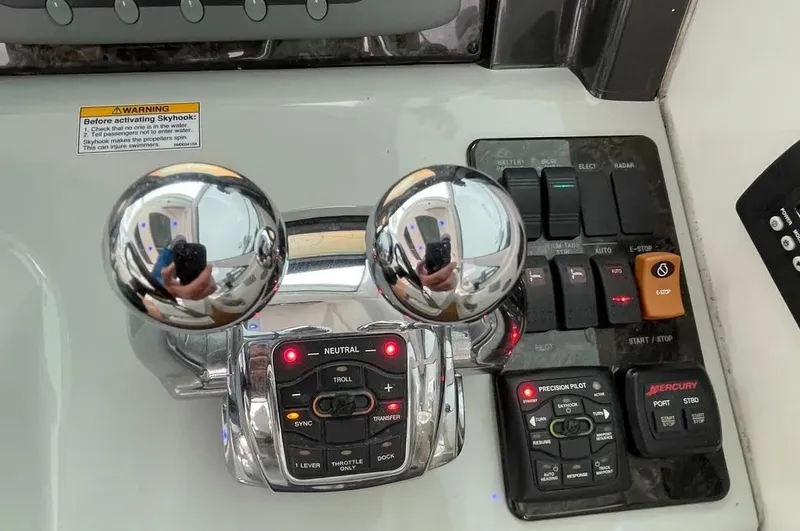 Down Time Yacht Photos Pics Control panel of a 2010 Sea Ray 500 Sundancer boat with throttle and switches.