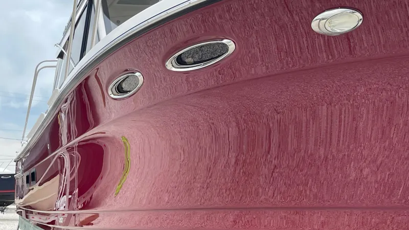  Yacht Photos Pics 2018 Cutwater C-30 Command Bridge LE boat with sleek red hull design.