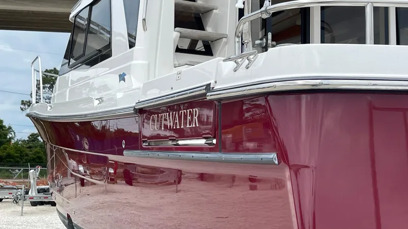  Yacht Photos Pics 2018 Cutwater C-30 Command Bridge LE boat with sleek red hull design.