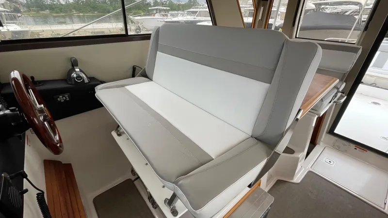  Yacht Photos Pics Interior of 2018 Cutwater C-30 Command Bridge LE, featuring helm seat and steering wheel.