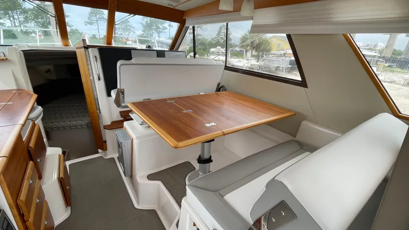  Yacht Photos Pics 2018 Cutwater C-30 Command Bridge LE interior with dining area and seating.
