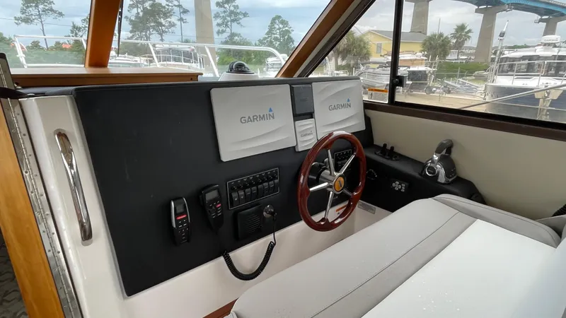 Yacht Photos Pics 2018 Cutwater C-30 Command Bridge LE helm with Garmin displays and steering wheel.