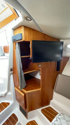  Yacht Photos Pics 2018 Cutwater C-30 Command Bridge LE interior with TV and wooden cabinetry.