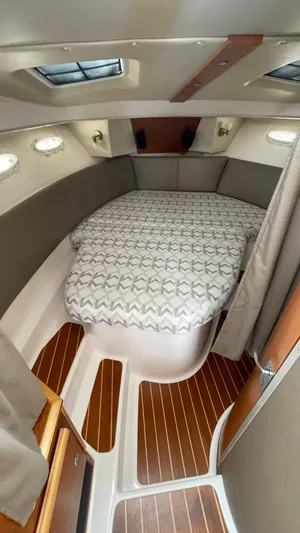  Yacht Photos Pics 2018 Cutwater C-30 Command Bridge LE cabin with cozy bed and elegant wood flooring.