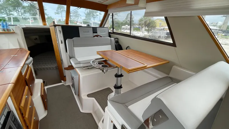  Yacht Photos Pics 2018 Cutwater C-30 Command Bridge LE interior with seating and dining area.