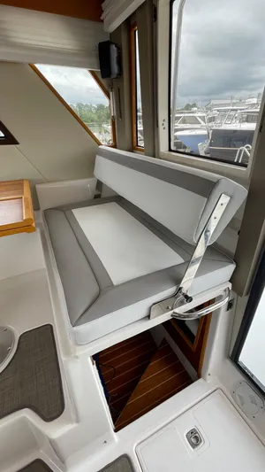  Yacht Photos Pics 2018 Cutwater C-30 Command Bridge LE interior with gray seating and wooden accents.