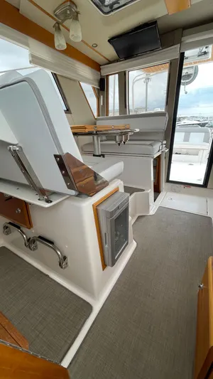  Yacht Photos Pics 2018 Cutwater C-30 Command Bridge LE interior with seating and helm station.