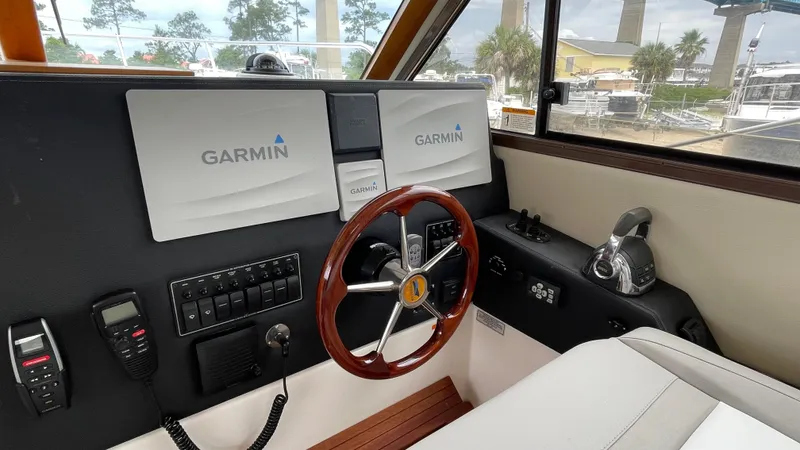  Yacht Photos Pics 2018 Cutwater C-30 Command Bridge LE helm with Garmin navigation system and wooden steering wheel.