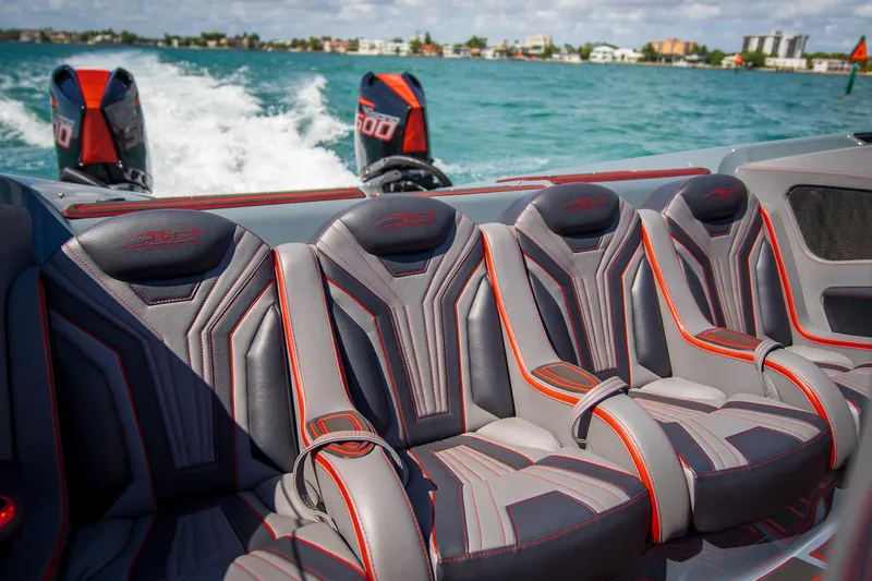  Yacht Photos Pics 2024 MTI 390X boat interior with stylish seats and powerful engines on the water.