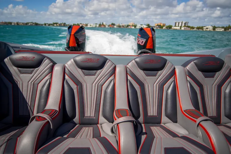  Yacht Photos Pics 2024 MTI 390X boat interior with sleek seats and powerful engines on the water.