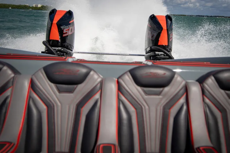  Yacht Photos Pics 2024 MTI 390X speedboat with dual engines, sleek seats, and ocean backdrop.