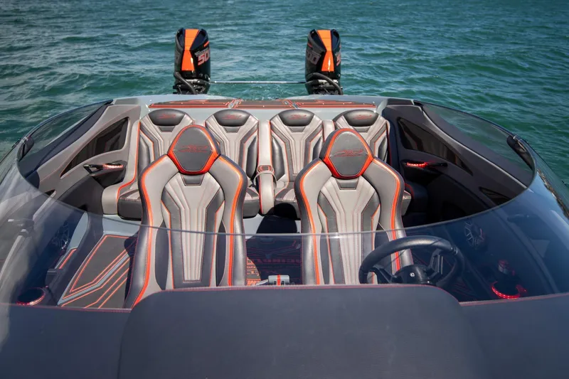  Yacht Photos Pics 2024 MTI 390X boat interior with sleek seats and dual outboard motors on water.