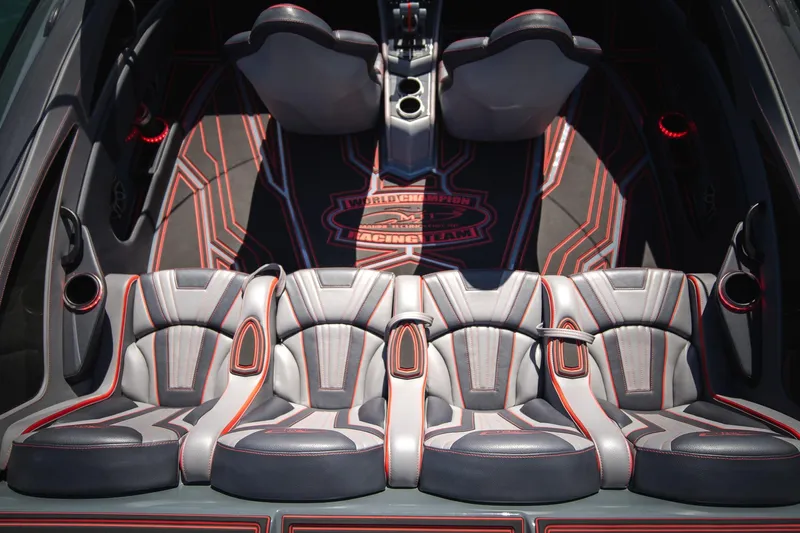  Yacht Photos Pics Luxurious interior of 2024 MTI 390X with stylish seating and racing-themed design.