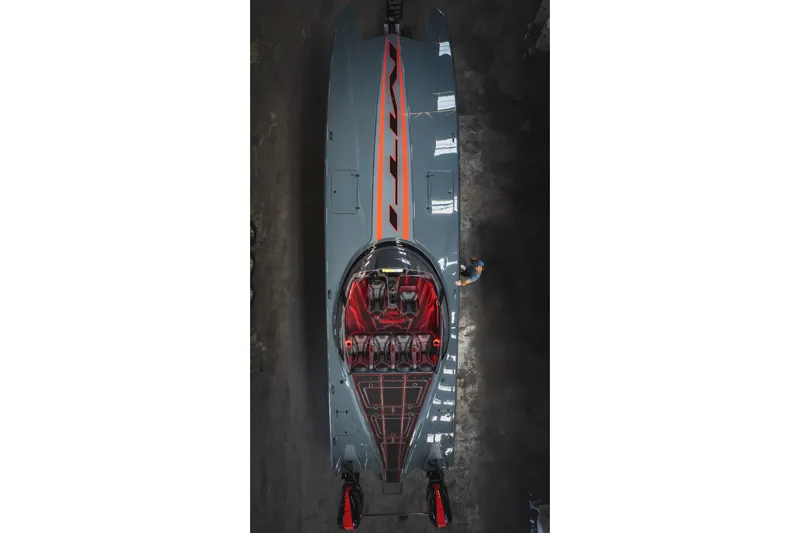  Yacht Photos Pics Aerial view of 2024 MTI 390X powerboat with sleek design and vibrant red accents.