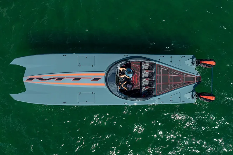  Yacht Photos Pics Overhead view of 2024 MTI 390X powerboat on green water.
