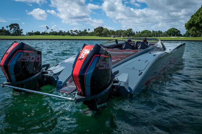  Yacht Photos Pics 2024 MTI 390X powerboat with dual 500R engines on a scenic waterway.