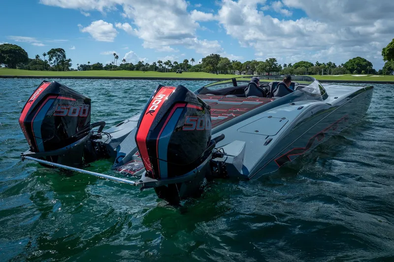  Yacht Photos Pics 2024 MTI 390X powerboat with dual 500R engines on a scenic waterway.