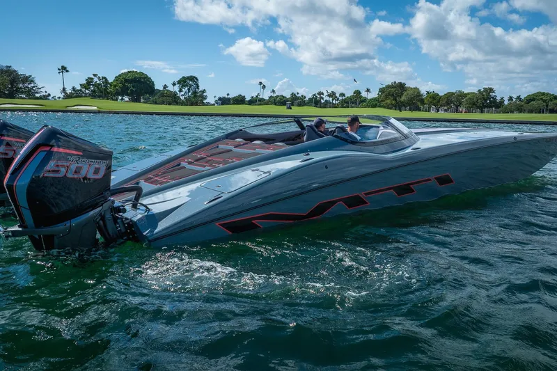  Yacht Photos Pics 2024 MTI 390X powerboat cruising on a sunny day with twin Racing 500 engines.