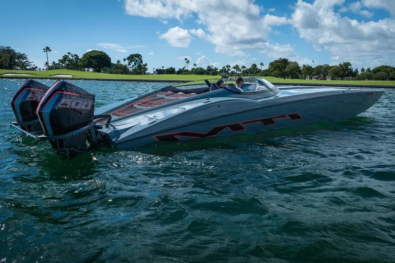  Yacht Photos Pics 2024 MTI 390X speedboat with dual engines cruising on a sunny day.