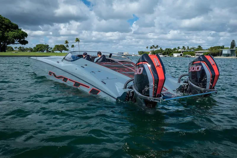  Yacht Photos Pics 2024 MTI 390X speedboat with dual 500R engines cruising on a sunny day.