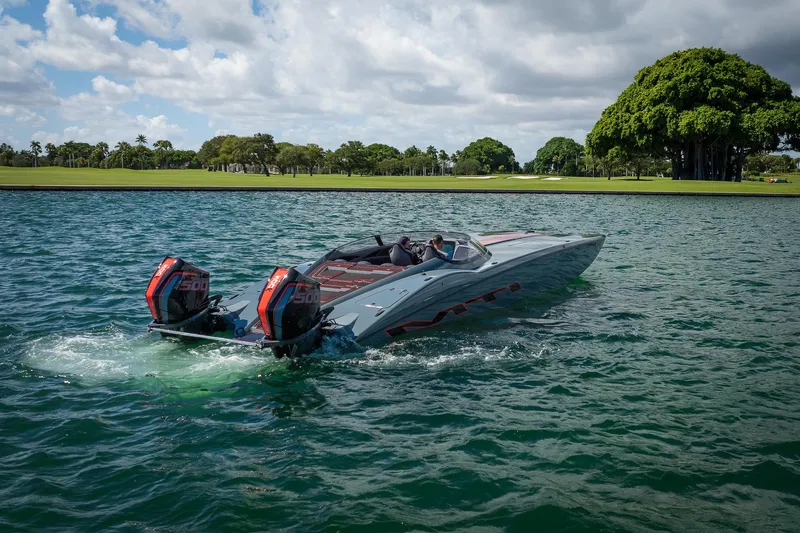  Yacht Photos Pics 2024 MTI 390X powerboat cruising on a scenic lake with dual engines.