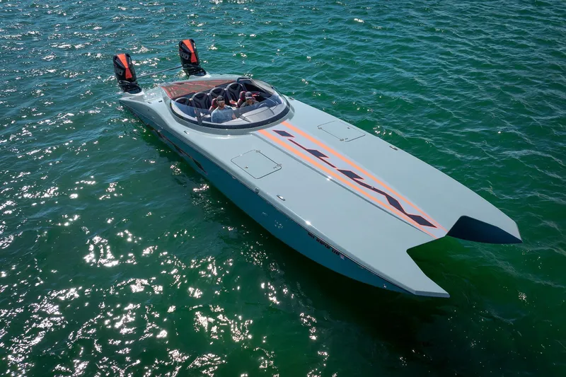  Yacht Photos Pics 2024 MTI 390X powerboat cruising on clear blue water.