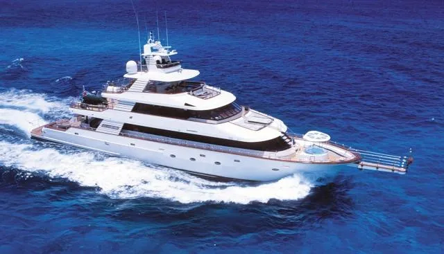 Forty Love Yacht Photos Pics Luxurious 2004 Westport Custom yacht cruising on vibrant blue ocean waters.