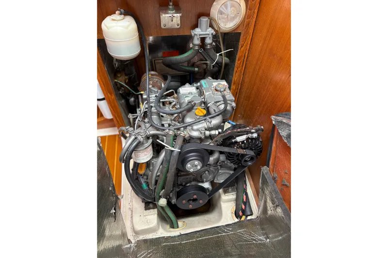  Yacht Photos Pics Engine compartment of a 2002 Hunter 386 sailboat, showcasing detailed mechanical components.