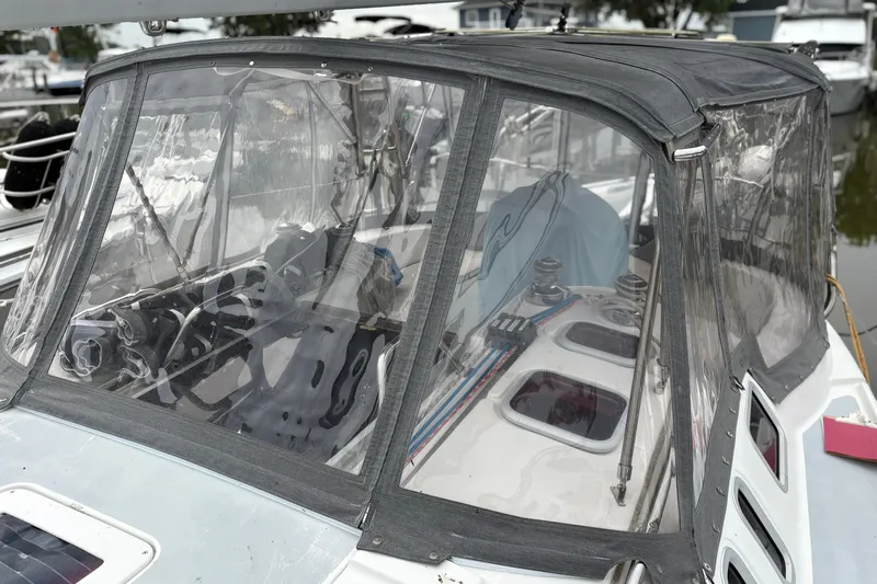 Yacht Photos Pics 2002 Hunter 386 sailboat cockpit with protective canopy and visible winches.