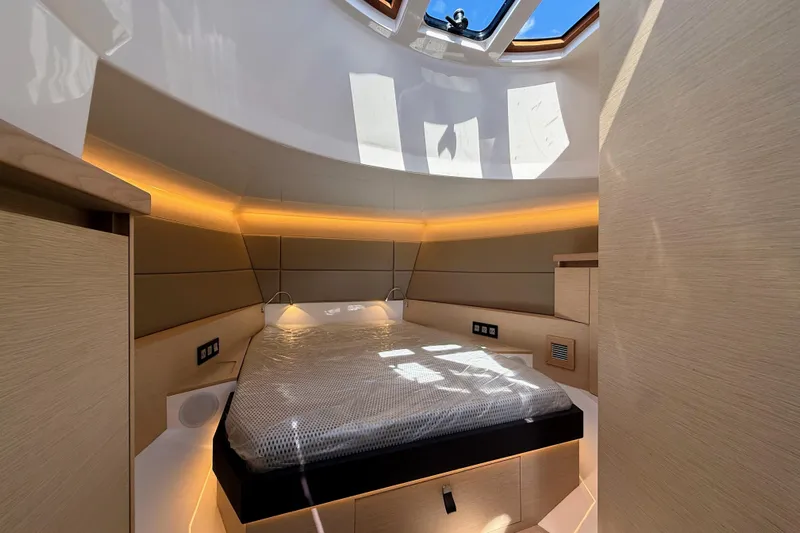 Mine Yacht Photos Pics Luxurious interior cabin of 2022 Tesoro T38 Outboard with modern design and ambient lighting.