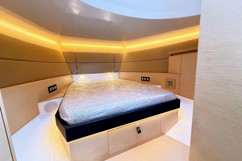 Mine Yacht Photos Pics Luxurious interior of 2022 Tesoro T38 Outboard with modern lighting and cozy bedding.