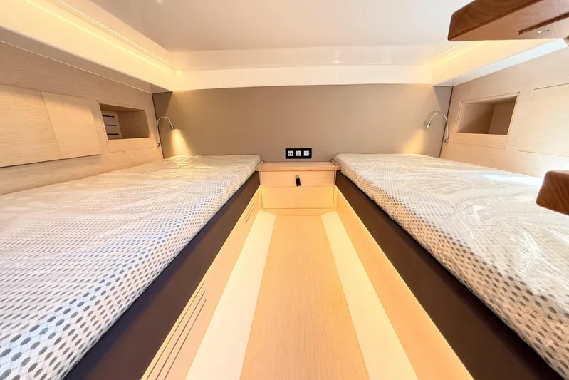 Mine Yacht Photos Pics 2022 Tesoro T38 Outboard cabin interior with twin beds and modern lighting.