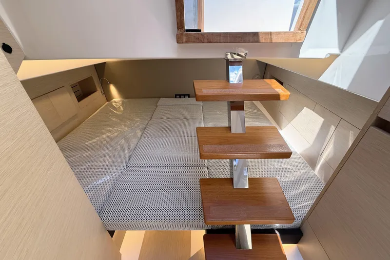 Mine Yacht Photos Pics 2022 Tesoro T38 Outboard cabin interior with wooden steps and modern design.
