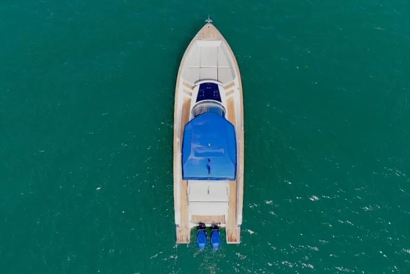 Mine Yacht Photos Pics Aerial view of 2022 Tesoro T38 Outboard boat on turquoise water.