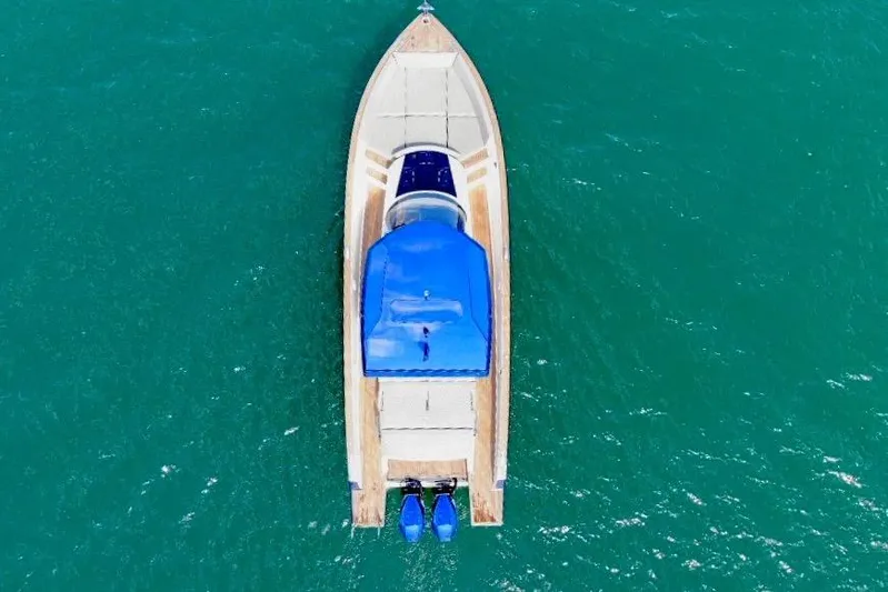 Mine Yacht Photos Pics Aerial view of 2022 Tesoro T38 Outboard boat on turquoise water.