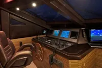 Luxurious Tecnomar 100 yacht helm with leather chair and advanced navigation systems, 2009 model.