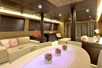 Luxurious interior of 2009 Tecnomar 100 yacht with modern furnishings and ambient lighting.