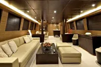 Luxurious interior of 2009 Tecnomar 100 yacht with elegant seating and modern decor.