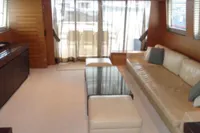 Luxurious Tecnomar 100 yacht interior, 2009 model, featuring elegant seating and modern decor.