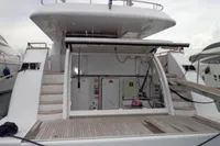 Stern view of 2009 Tecnomar 100 yacht with open storage compartment.