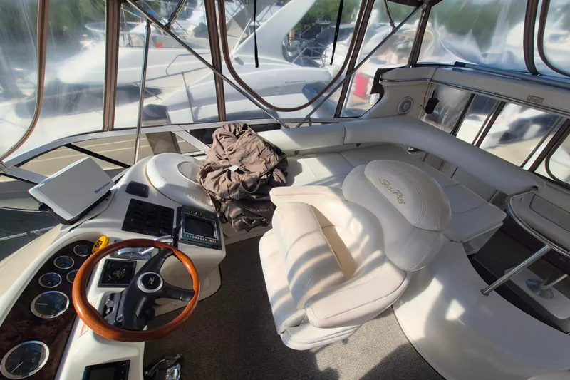Funny Cide Yacht Photos Pics 1999 Sea Ray 420 Aft Cabin yacht interior with helm, seating, and navigation equipment.