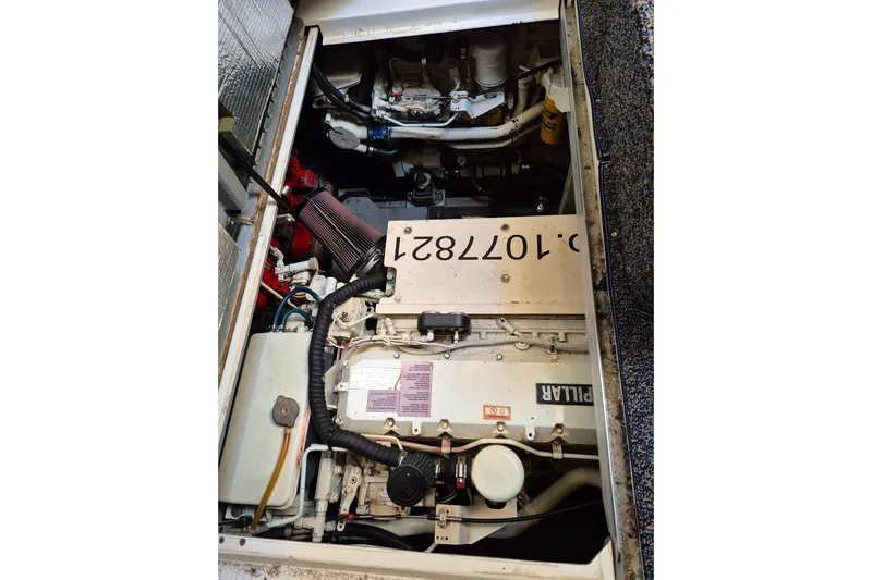 Funny Cide Yacht Photos Pics Engine compartment of a 1999 Sea Ray 420 Aft Cabin boat, featuring a Caterpillar engine.