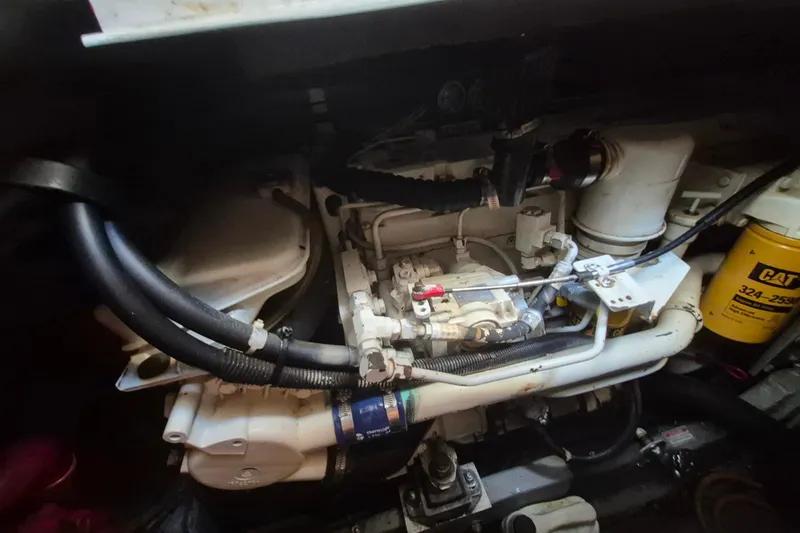 Funny Cide Yacht Photos Pics Engine compartment of a 1999 Sea Ray 420 Aft Cabin boat, featuring mechanical components.