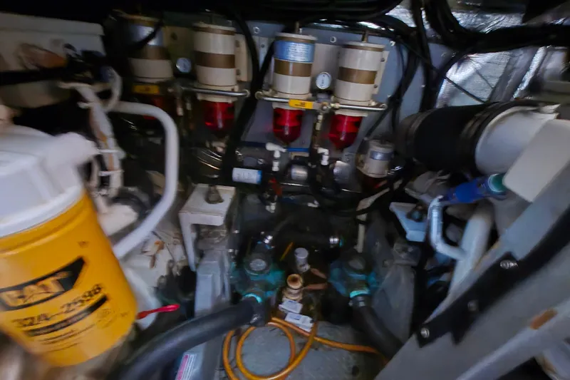 Funny Cide Yacht Photos Pics Engine room of 1999 Sea Ray 420 Aft Cabin with fuel filters and hoses.