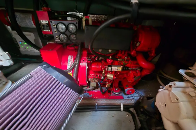 Funny Cide Yacht Photos Pics Engine room of a 1999 Sea Ray 420 Aft Cabin with visible machinery components.