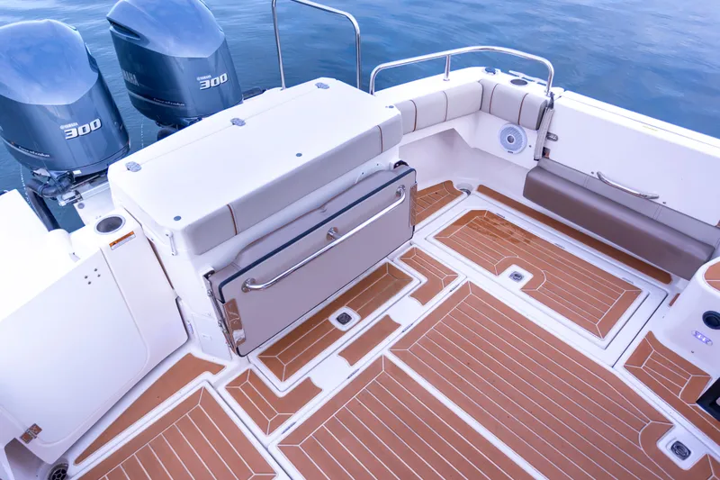  Yacht Photos Pics 2021 Cutwater C-32 CB boat deck with twin 300 engines and teak flooring.